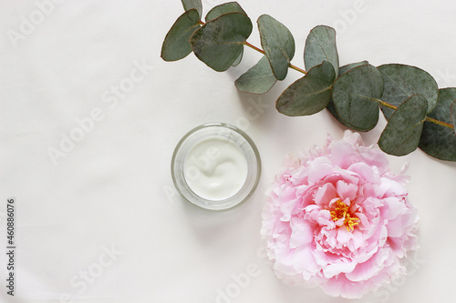 Beauty concept jar with cream and eucalyptus