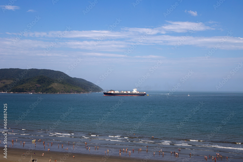 Santos beach panoramic view from above. With a view of Ponta da Praia and a large ship entering the Port of Santos