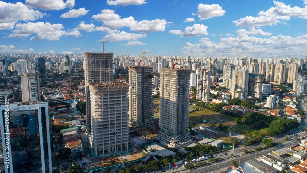 Aerial drone view of the Brooklin neighborhood in São Paulo, Brazil. Four tall buildings under construction