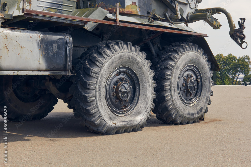 Big wheels are lowered from the big vehicle of the car. Big wheels are lowered from the big vehicle of the car.