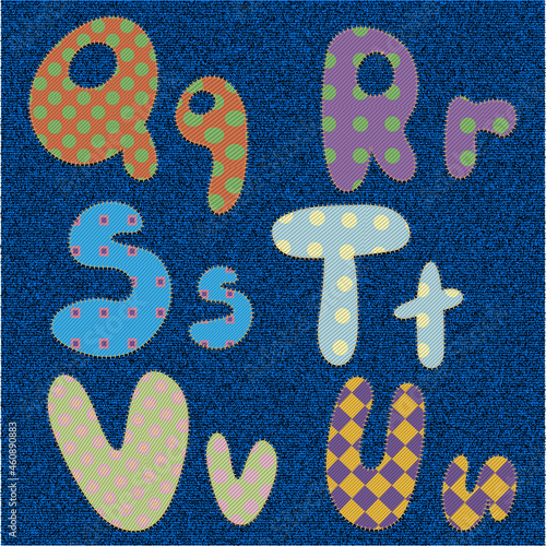 Part of the alphabet made of bright fabric-colored letters sewn onto denim.Part three