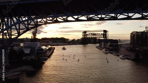 Sunset on river paddleboarders - Cuyahoga River - Cleveland, OH photo