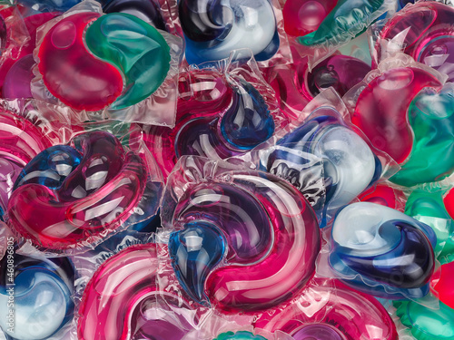 Background of gel capsules with laundry detergent