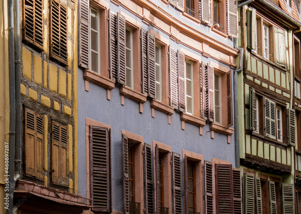 Colorful houses and wooden window shutter in Colmar, France