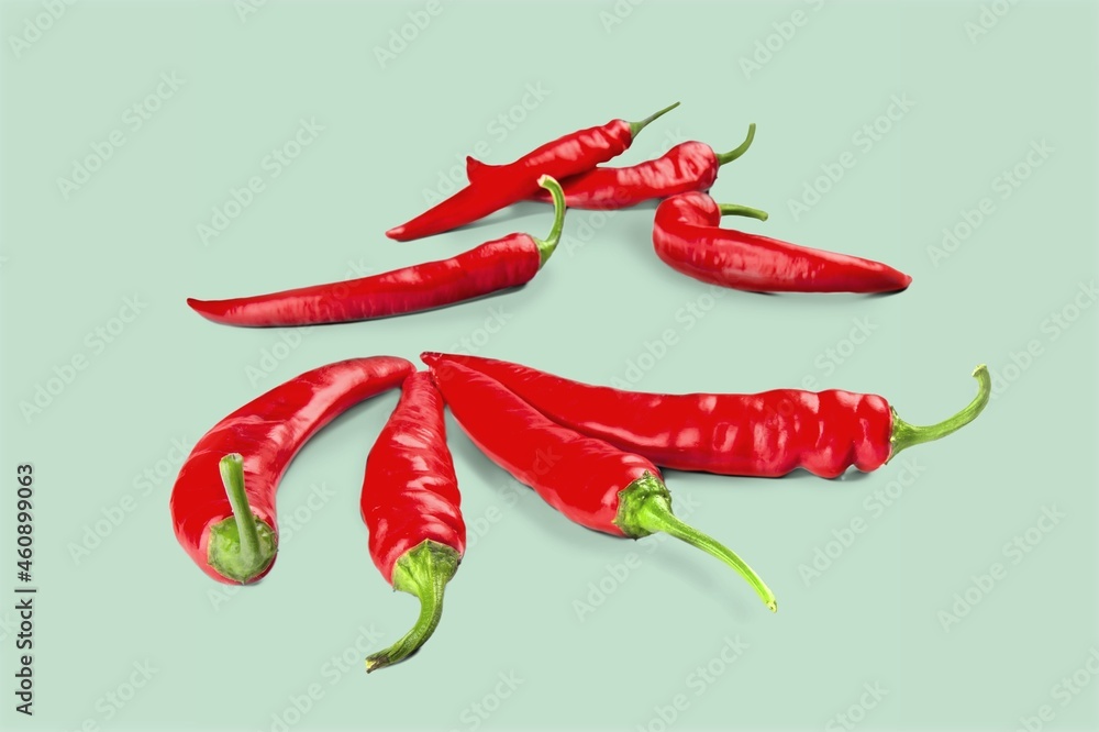 Fresh spicy red chilli peppers with seeds floating in the air. Fresh spicy red chilli peppers with seeds floating in the air.