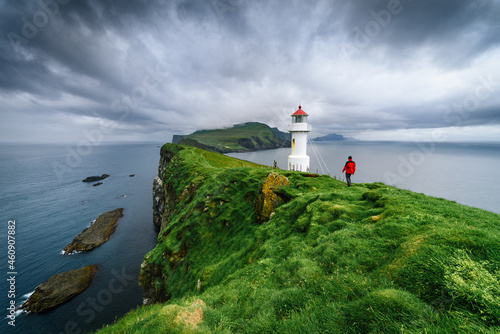Hiking in Mykines near Holmur Lighthouse, Faroe Islands