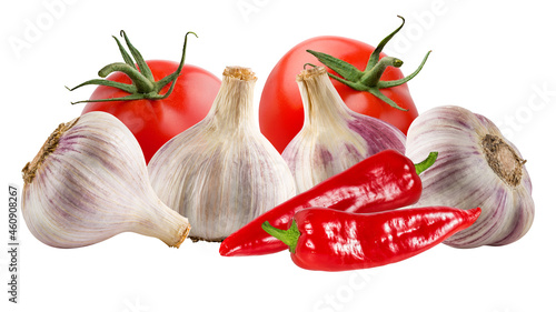 Garlics, tomatoes with red hot chili peppers isolated on white background
