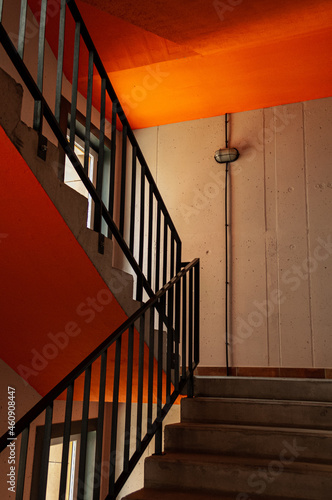 Entrance to the house, multi-storey residential building. Loft style interior. Orange.