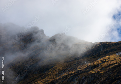 Landscape with clouds on mountain ridges