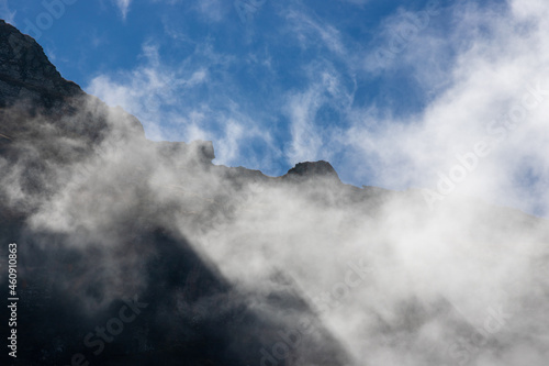 landscape with clouds on top of mountain ridges © sebi_2569