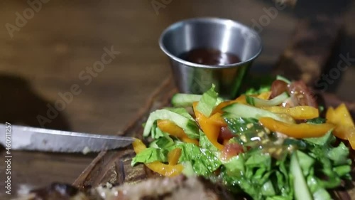 beef steak is sliced and dipped in sauce