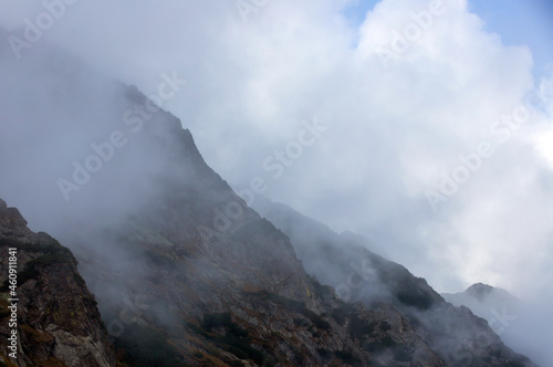 a beautiful landscape with fog on the mountain slope © sebi_2569