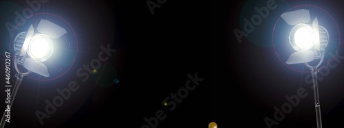 Movie lights in the dark, cinema lighting on black background with copy space