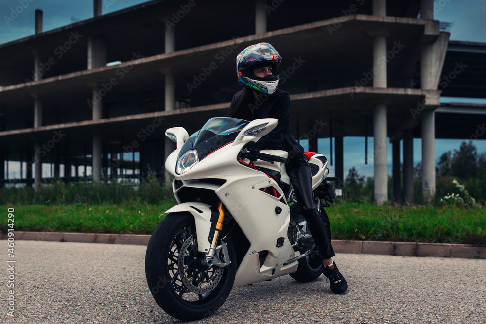 Fototapeta premium Woman biker at the sport motorcycle 
