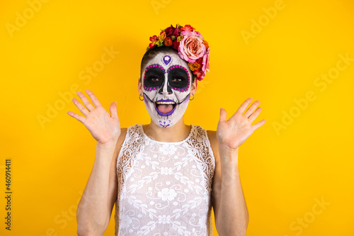 Mexican Catrina, portrait of young latin woman for Halloween party in Mexico city 