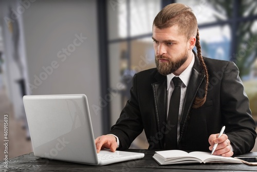 Mature business man using laptop computer having video conference call © BillionPhotos.com