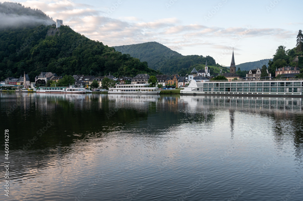 View on Mosel river, hills with vineyards and old town Traben-Trarbach, Germany