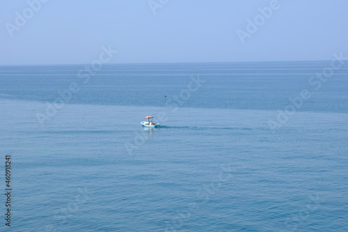 Alone man is fishing in the sea