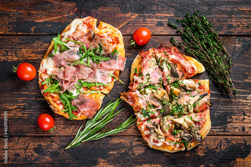 Fototapeta Sliced pizza with prosciutto parma ham, arugula and parmesan cheese