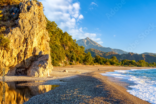 Cirali Olympos beach. Sea and mountains. Kemer, Antalya, Turkey. photo