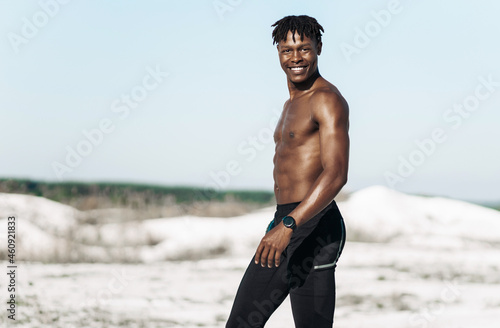 Portrait african american man  fitness athlete  with muscular naked torso  outdoors in nature