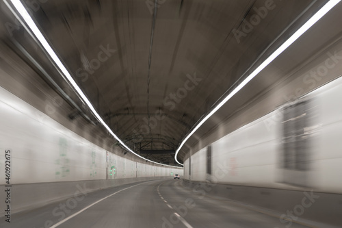 modern underground tunnel with gray road tunnel of motion car, transportation background.
