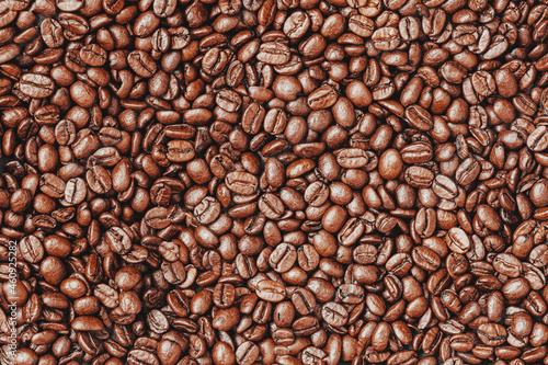 Closeup of roasted black coffee beans. Flat lay. Top view. Food background, texture