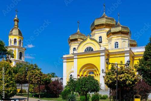 A beautiful yellow church in central park. Welcome to Gagauzia, Moldova. Comrat city center. Background photo