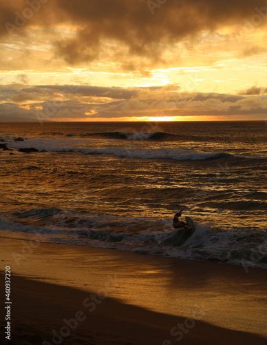 Fototapeta Naklejka Na Ścianę i Meble -  Golden Beach Sunset with Surfer