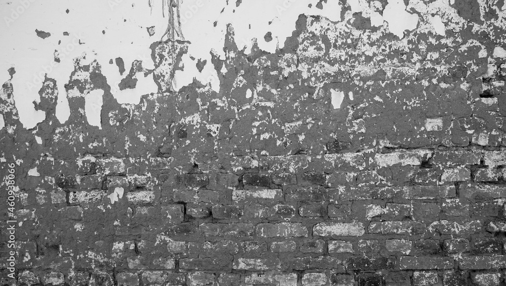 the beautiful ancient texture of the brick and concrete walls. the damaged old wall is weathered, generating a pretty construction texture.