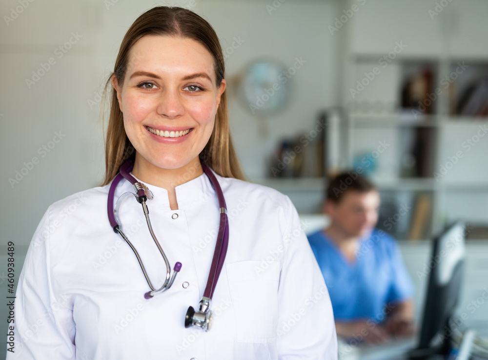 © JackF - Portrait of smiling young female doctor meeting patient in medical office