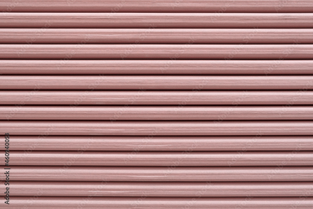 Close-up of red gypsum side edge stack of Plasterboard core with fiberglass mechanical strength and fire resistance increase. indoor concrete walls prepared for construction Close-up of red gypsum side edge stack of Plasterboard core with fiberglass mechanical strength and fire resistance increase. indoor concrete walls prepared for construction