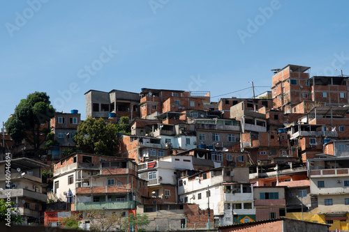 urban area with slums, simple buildings usually built on the hillsides of the city