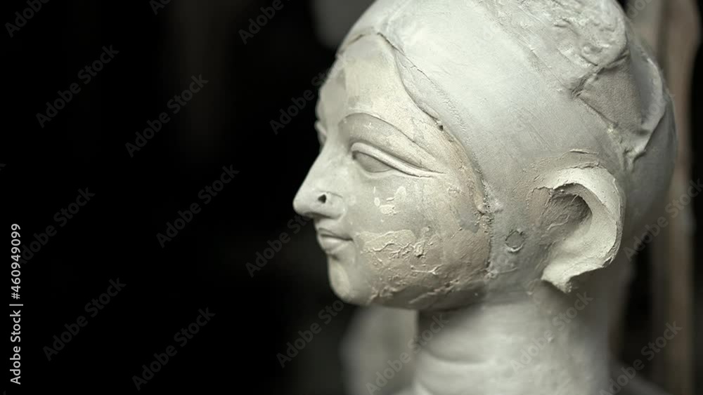 Kolkata, India : Close up shot of Goddess Durga idol left for drying under the sun; black and white photo of Goddess Durga captured till the neck. Kolkata, India : Close up shot of Goddess Durga idol left for drying under the sun; black and white photo of Goddess Durga captured till the neck.