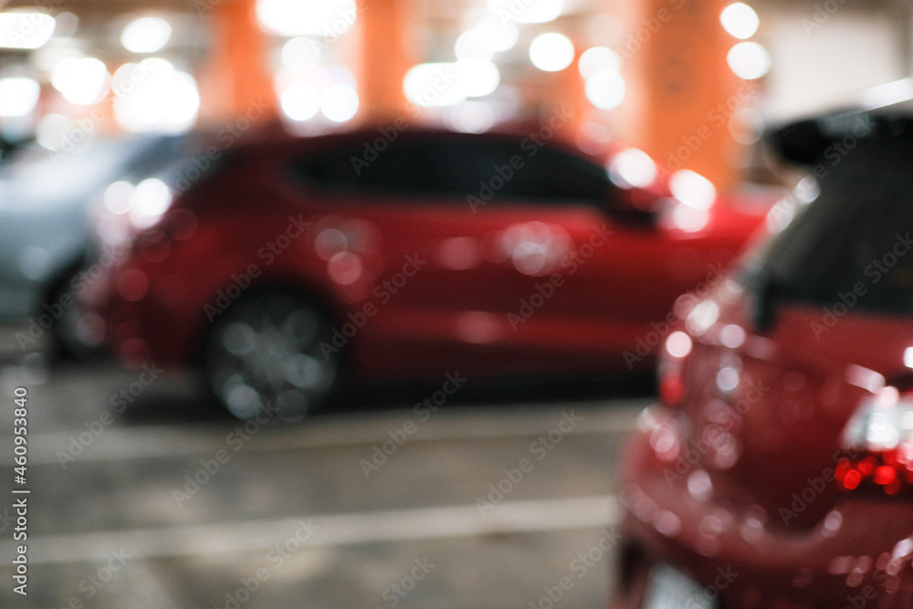 Car parking indoor of supermarket store blurred bokeh with tonned