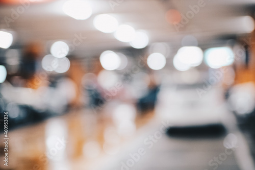 Car parking indoor of supermarket store blurred bokeh with tonned