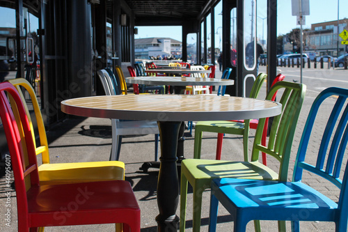 colorful tables and chairs in a restaurant © SWOF.ph