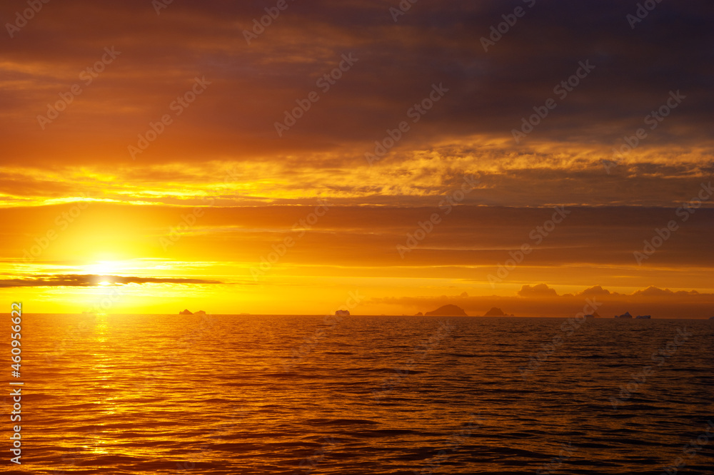 Golden sunset in antarctic sea.