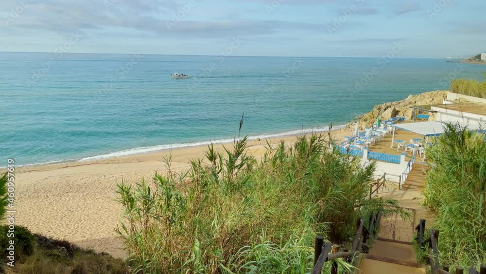 Beautiful paradise beach in the Mediterranean Costa del Maresme Barcelona aerial view turquoise blue water with natural rocks
