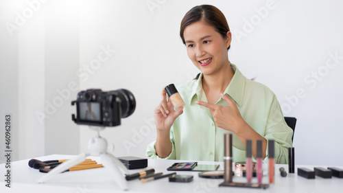 A beauty blogger showing hi-end beauty products advertising their benefits and hot promotions