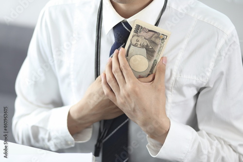 Close up of businessman holding currency