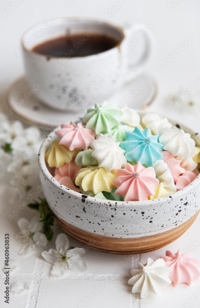 Cup with coffee and small meringues Cup with coffee and small meringues
