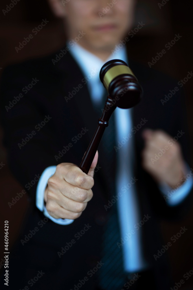 Close up of lawyer holding gavel. justice and law concept