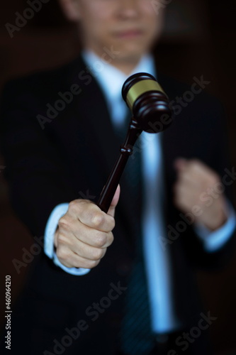 Close up of lawyer holding gavel. justice and law concept