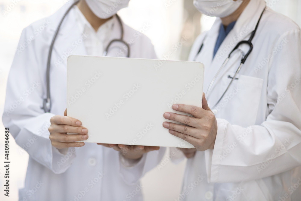 Doctor reviewing medical data with laptop Doctor reviewing medical data with laptop