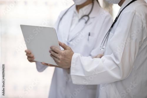Doctor reviewing medical data with laptop