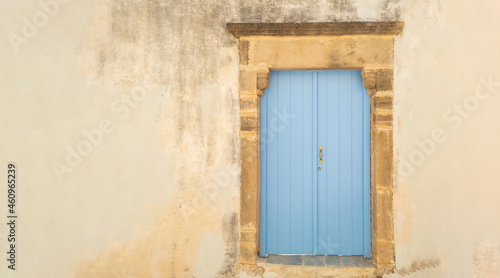 Window shutters on a wall. Facade of old stone building