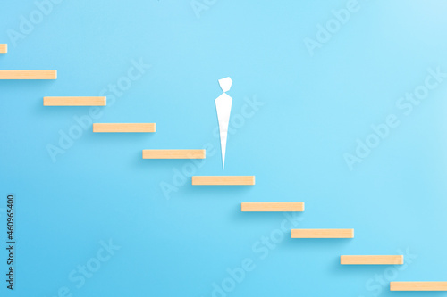 Business failure with Depressed businessman icon standing on the wooden block stairs