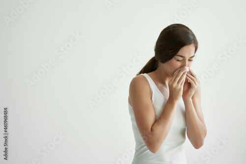 woman cold handkerchief runny nose health problems