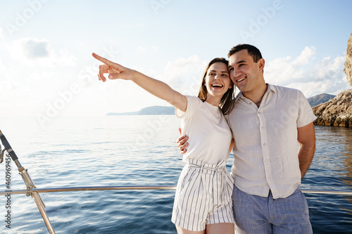 Happy couple on a yacht in summer on romantic vacation